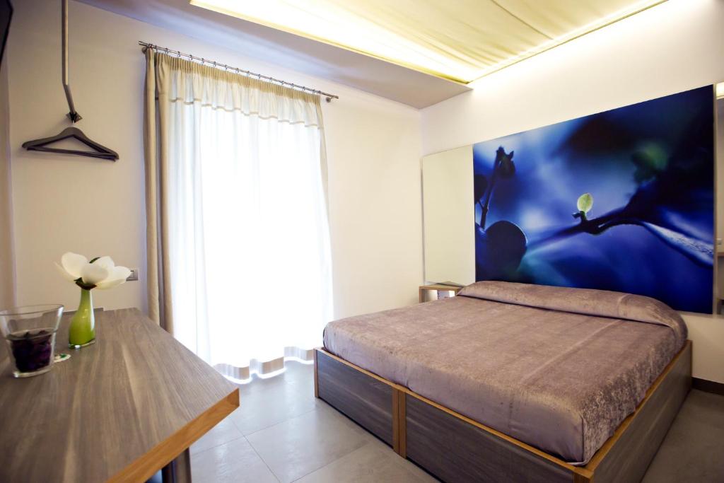 Postel nebo postele na pokoji v ubytování Hotel Tiro a Volo