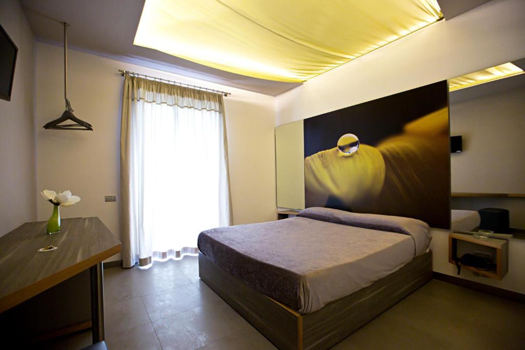 Postel nebo postele na pokoji v ubytování Hotel Tiro a Volo