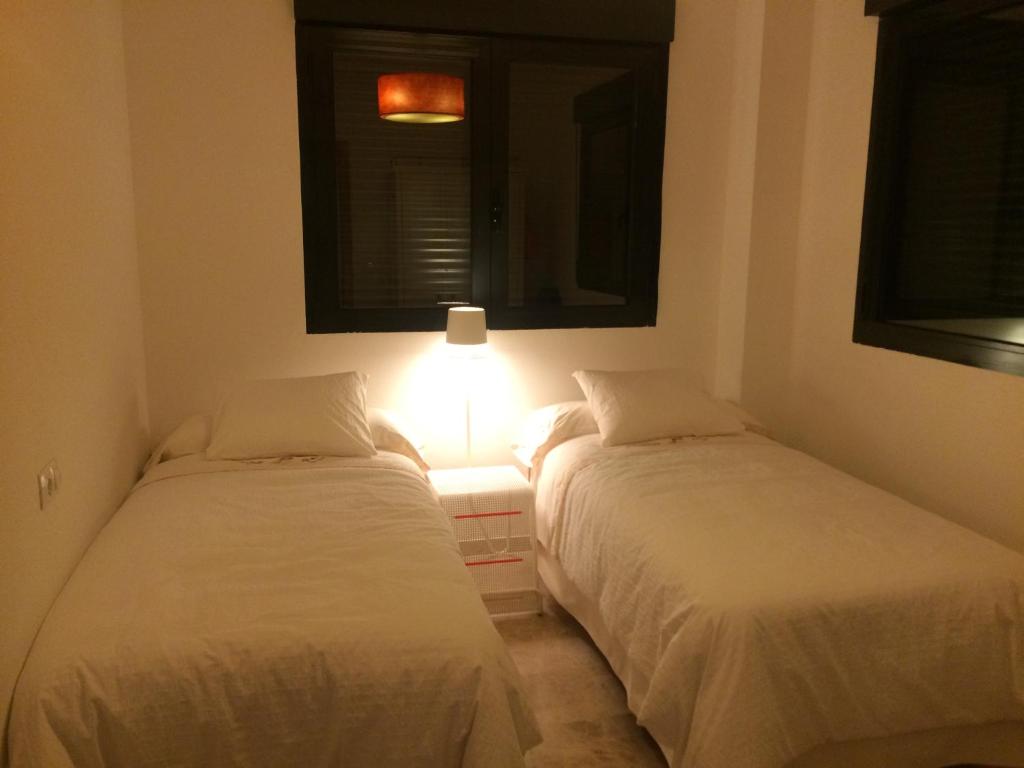 A bed or beds in a room at Canaima Alicante
