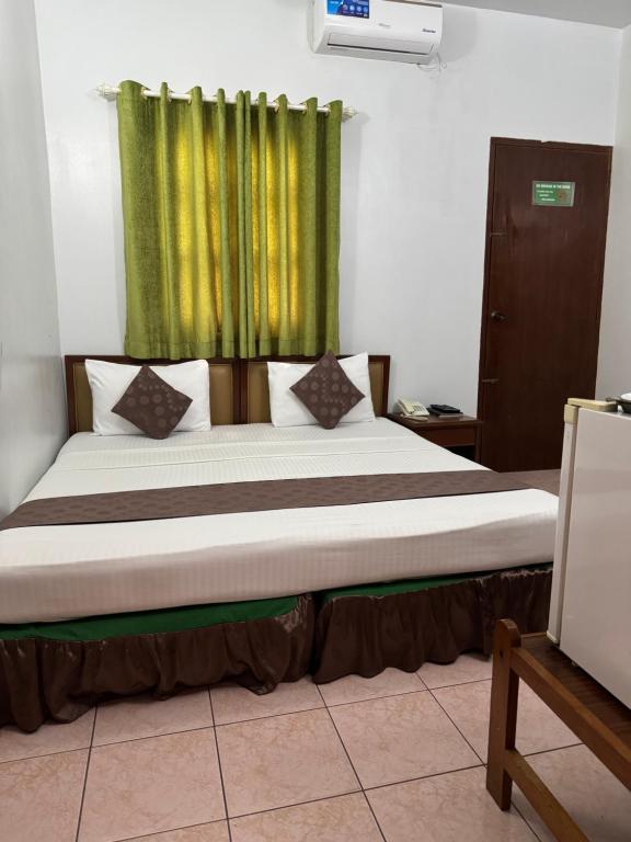 Ένα ή περισσότερα κρεβάτια σε δωμάτιο στο Skai Lodge