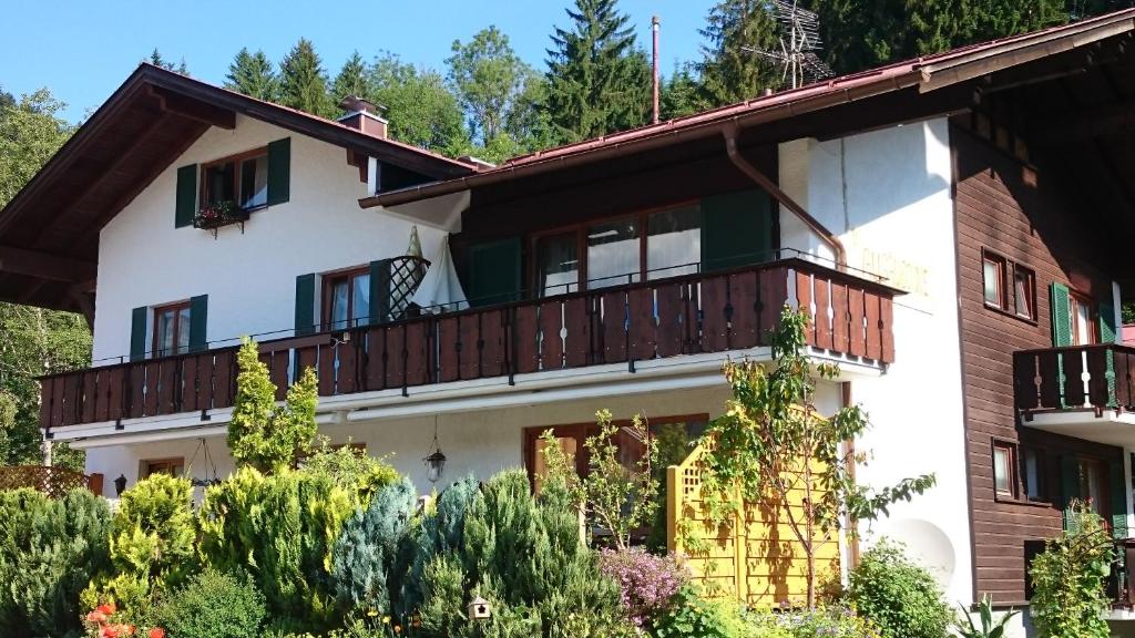 a large white house with a balcony at Allgäu Sonne in Oberstdorf