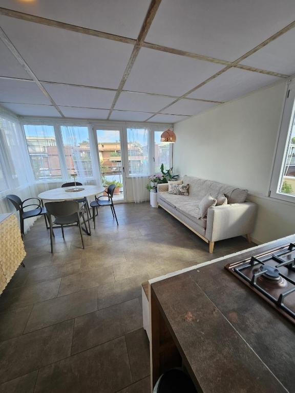 a living room with a couch and a table at La Terrazza in Rome