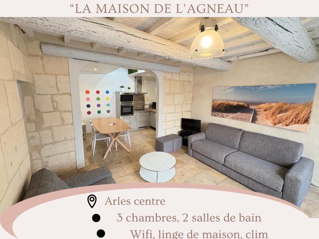 a living room with a couch and a table at Holiday in Arles -Maison du Centre Historique in Arles