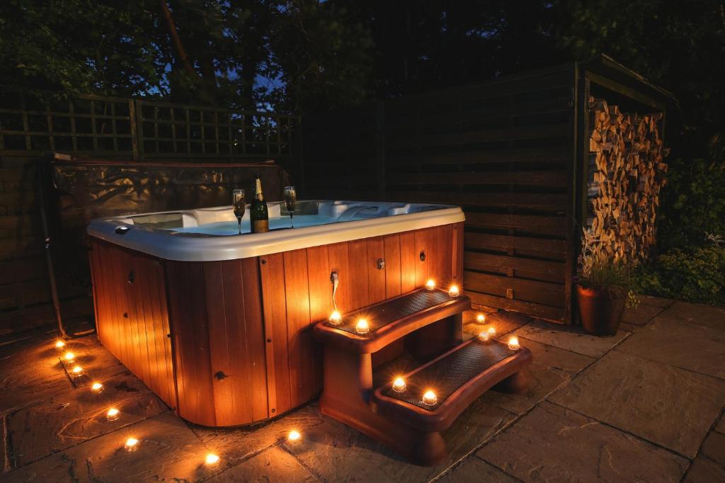 a jacuzzi tub with lights on a patio at Ann's Hill in Cockermouth