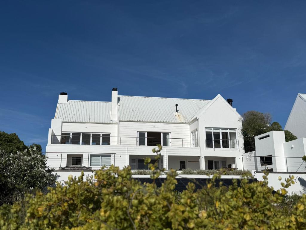 a large white house with a roof at Blanc de Blanc in Yzerfontein