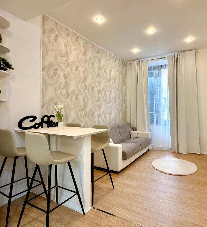 a living room with a table and a couch at Casa Telli - da Merilù in Turin