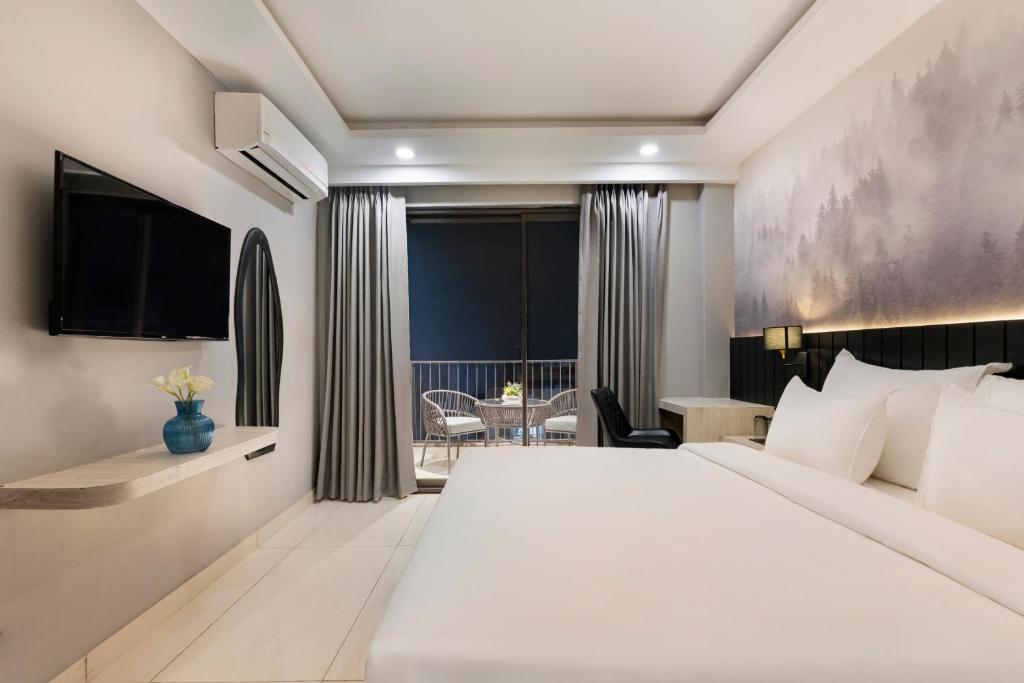 Ένα ή περισσότερα κρεβάτια σε δωμάτιο στο Smart Stays by Country Inn, Tapovan, Rishikesh