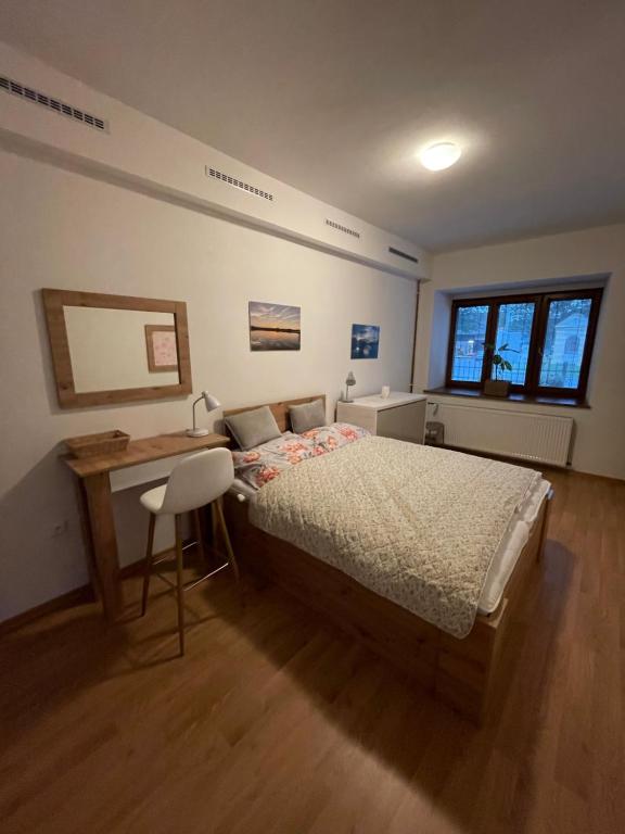 Una cama o camas en una habitación de Apartmány Obora v Podbezdězí