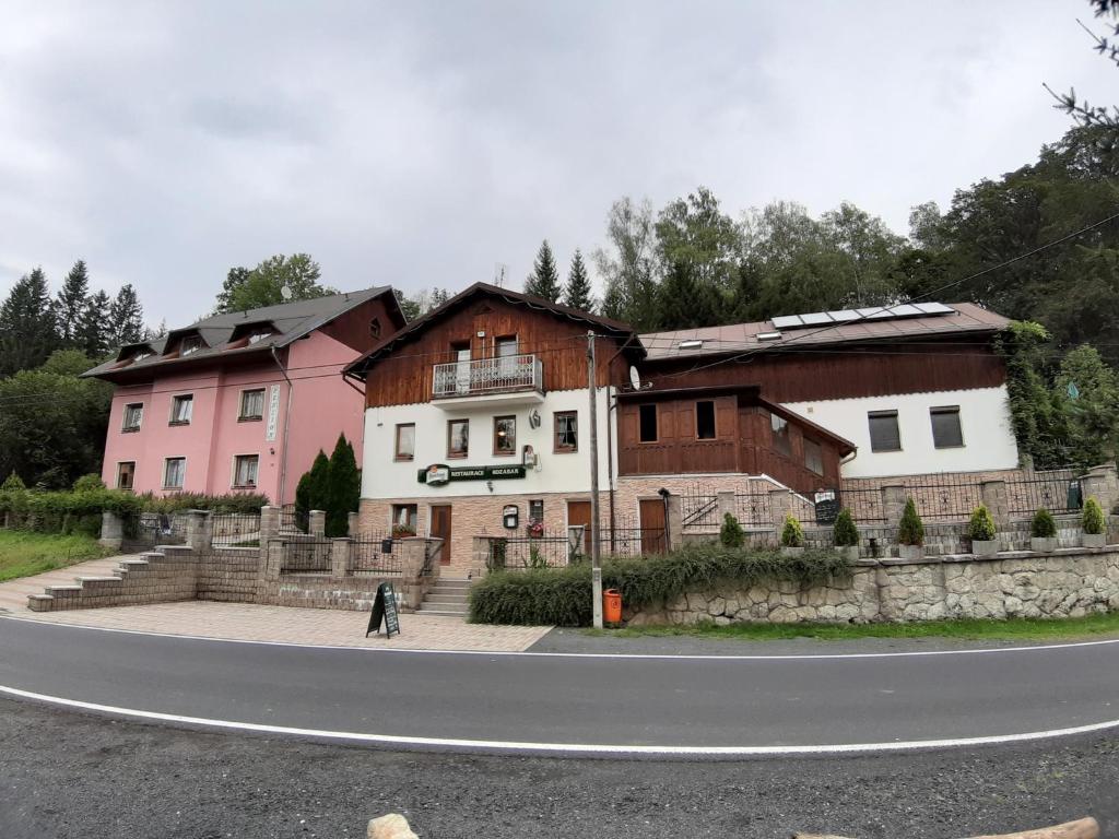 a building on the side of a road at Penzion & Restaurace Kozabar in Luby