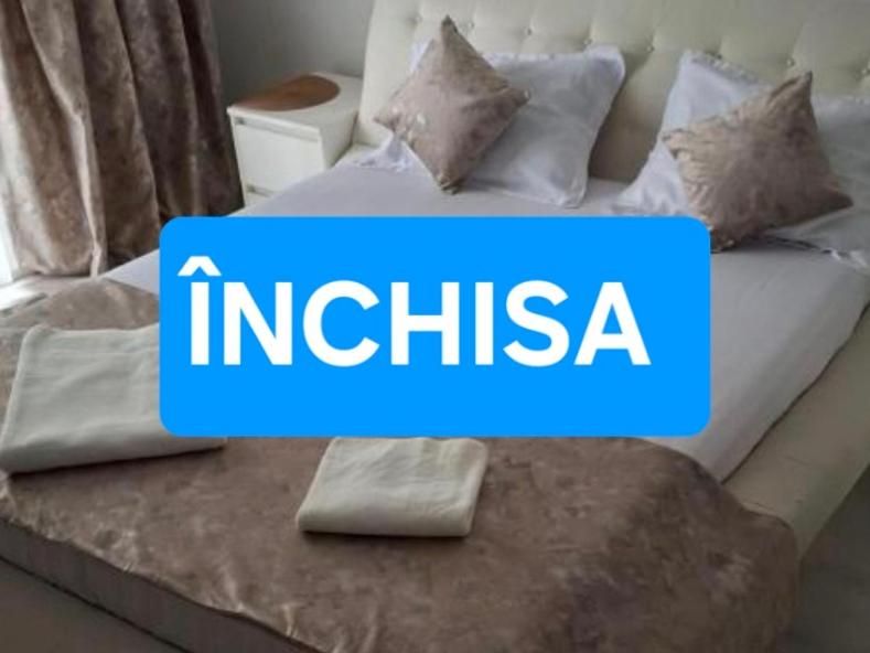 a bed with the word india written on it at Garsoniera in Bucharest