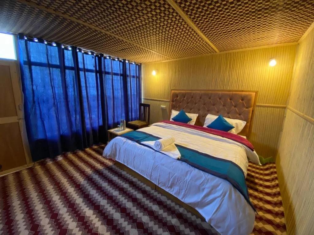Katil atau katil-katil dalam bilik di Alpine Cottage Pangong