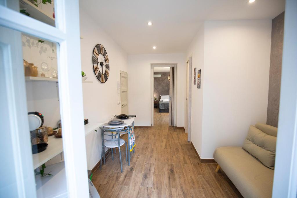 a living room with a couch and a table at Duomo View Apartment in Monreale
