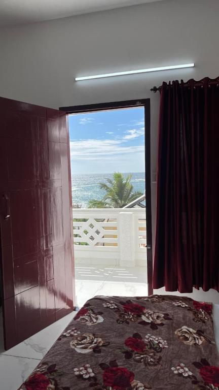 Postel nebo postele na pokoji v ubytování Hotel Paradise Kovalam