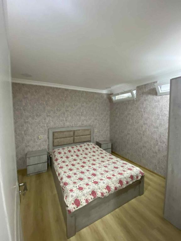 a bedroom with a bed in a room at Ruslan Hootel 3 in Poti
