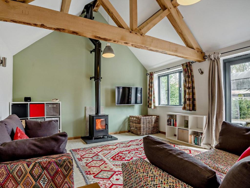 a living room with a wood stove in a room at 1 bed property in Lechlade 31912 in Lechlade
