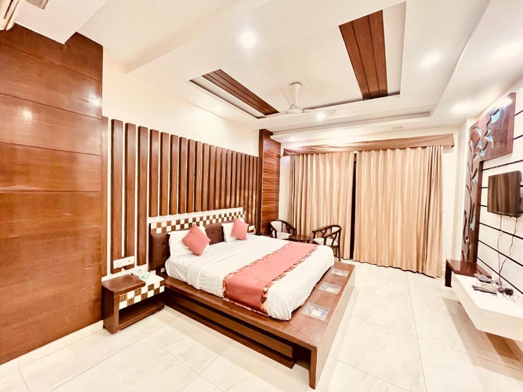 Ένα ή περισσότερα κρεβάτια σε δωμάτιο στο South Residency - South Delhi by South INN