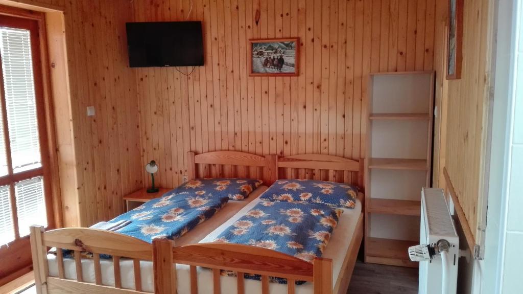 Postel nebo postele na pokoji v ubytování Penzion Jendrál