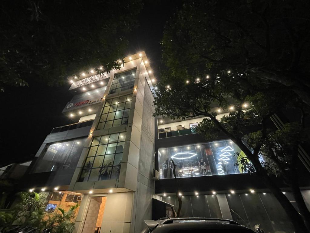 a building with lights on top of it at night at Hare Rama Guest House in Dehradun