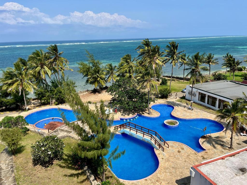 an aerial view of a resort with two swimming pools at Pwani luxe apartment in Mombasa