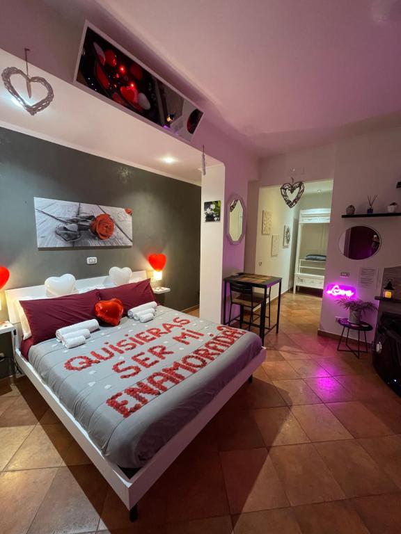a bedroom with a bed with a happy new year sign on it at Room24 Relax & Wellness in Genzano di Roma