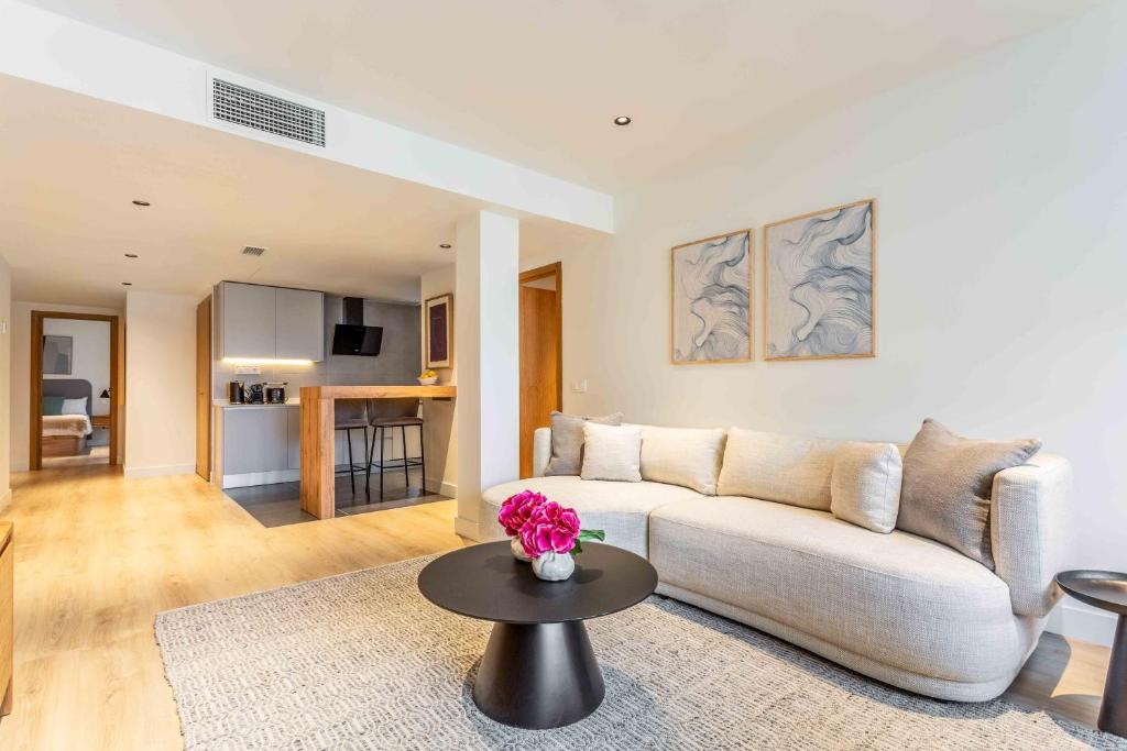 a living room with a couch and a table at Modern Stay in Plaza Castilla in Madrid
