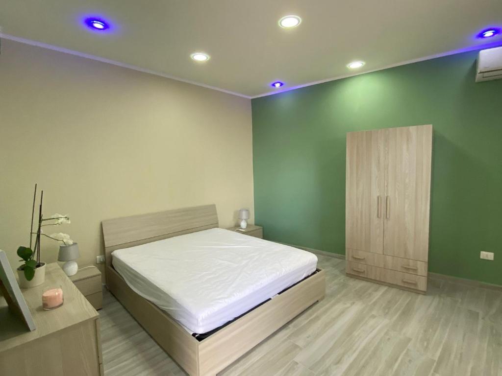 Giường trong phòng chung tại B&B Costa d'Amalfi Bellizzi