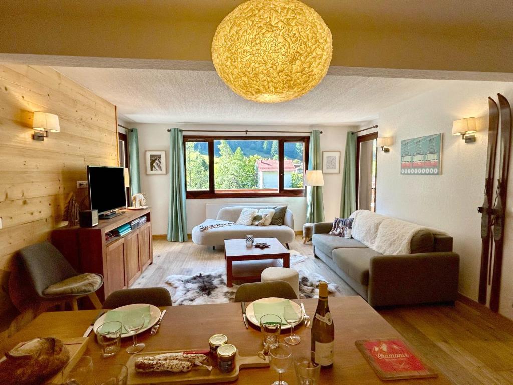 a living room with a couch and a table at Chez Charles I Vallorcine Viachamonix in Vallorcine