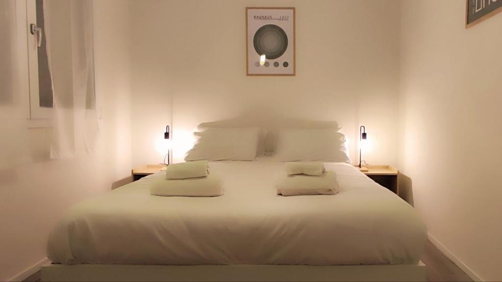 Cama o camas de una habitación en BauHaus Torino
