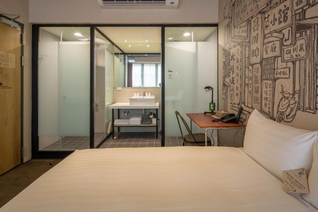 Postel nebo postele na pokoji v ubytování Cho Hotel