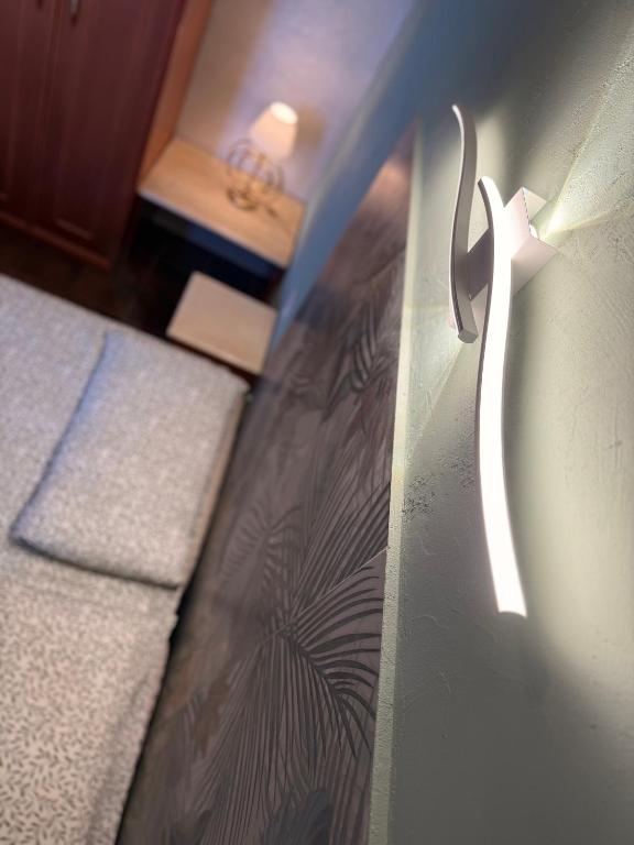 a corner of a room with a door with a wall at Casetta Cortese in Opera
