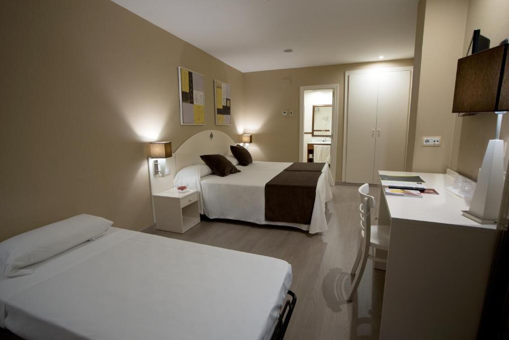 Postel nebo postele na pokoji v ubytování Hotel Torico Plaza