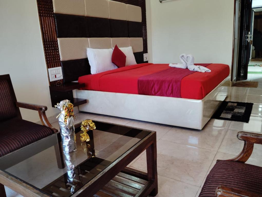 Postel nebo postele na pokoji v ubytování Hotel New Rajdarshan