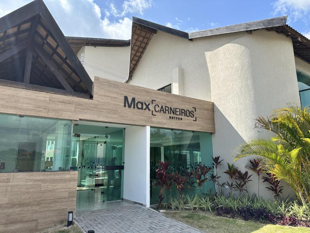 a building with a sign that reads max canteners at Studio Premium Praia dos Carneiros in Tamandaré