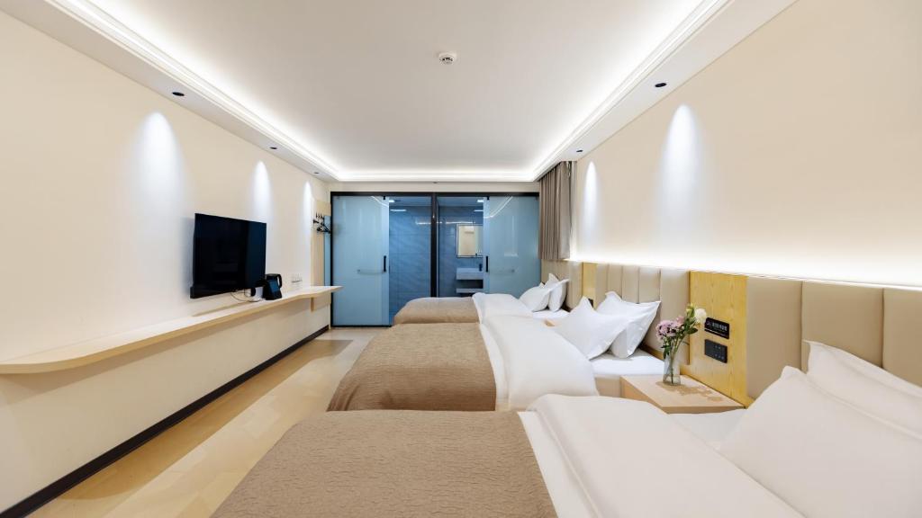 TV a/nebo společenská místnost v ubytování Sujianbeicheng Guanjing Meisu Inn