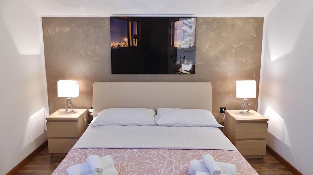 a bedroom with a large bed with two night stands at Villa Desideria in Bribir