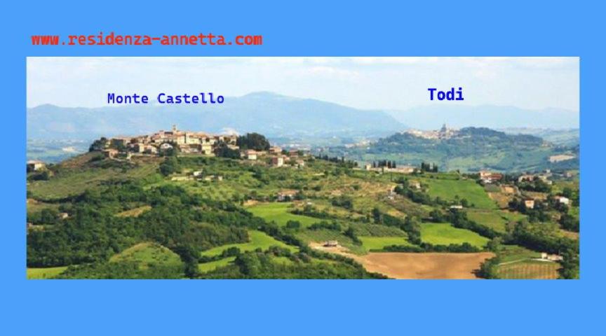 two pictures of a hill with a castle on it at Residenza Annetta in Monte Castello di Vibio