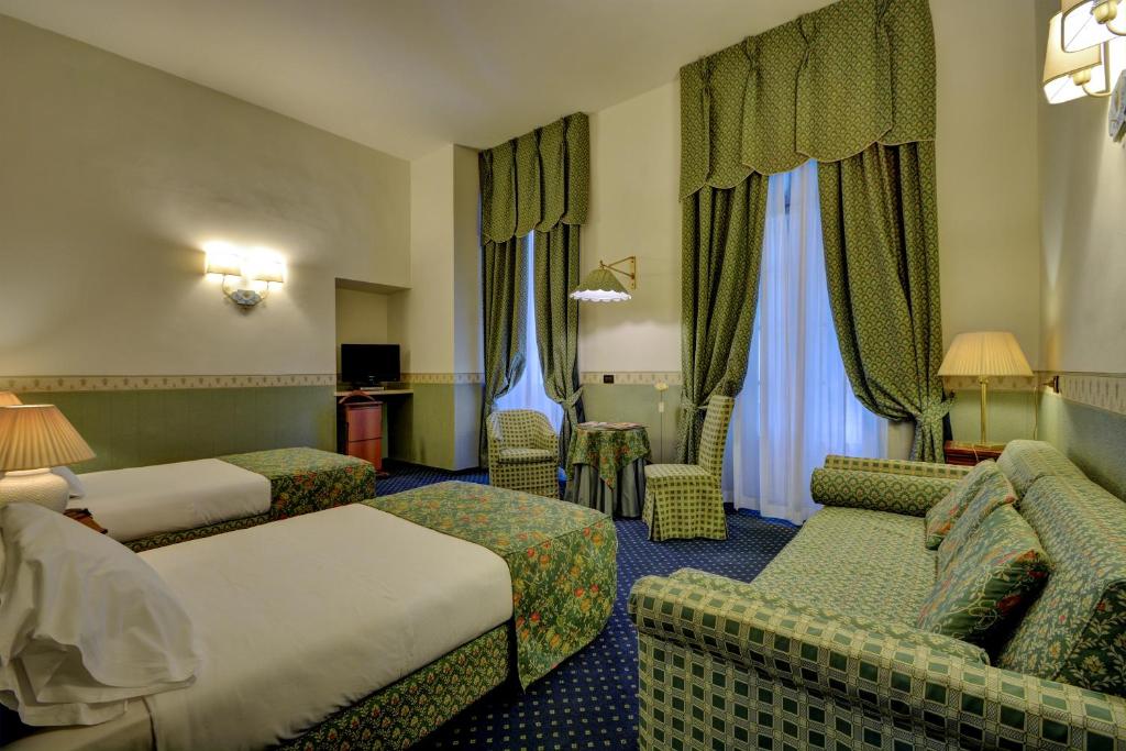 Postel nebo postele na pokoji v ubytování Best Western Hotel Genio
