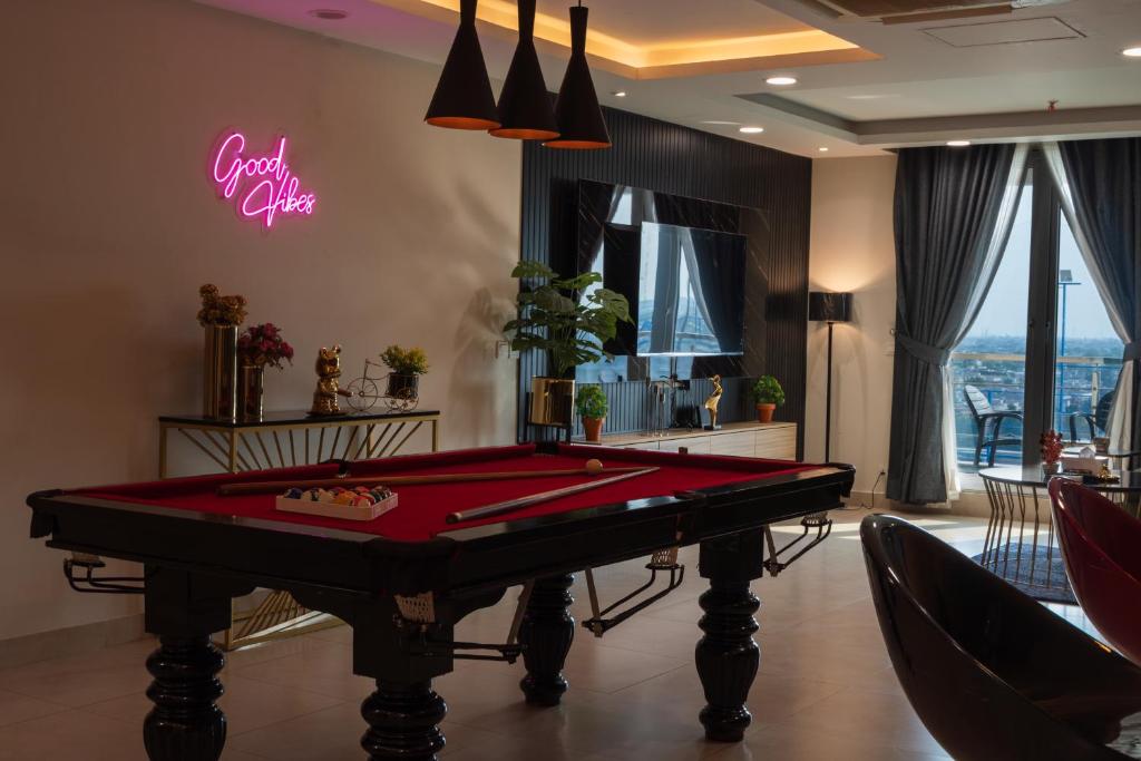 a billiard room with a pool table in it at Gold Crest Presidential Family Apartments-DHA Lahore Phase 4 in Lahore