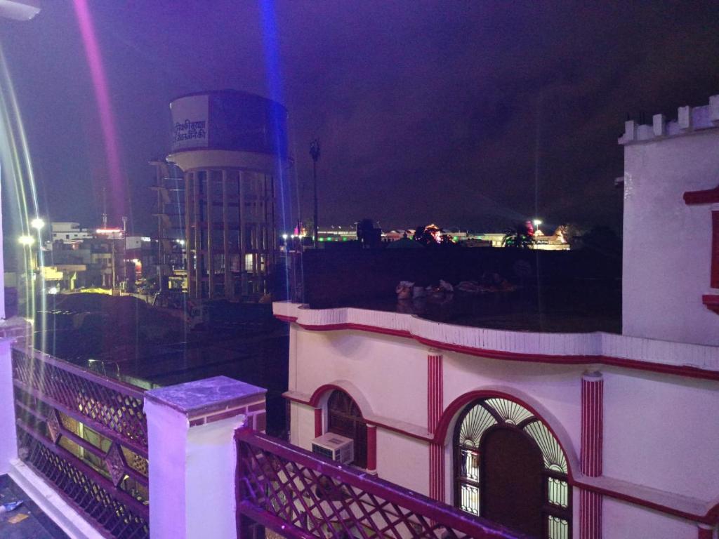 a view of a city at night with a building at Maa janki paying guest house in Ayodhya