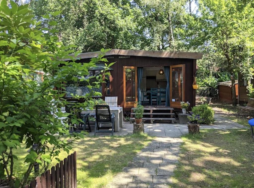 Κήπος έξω από το Chaletpark Kempenbos - 123