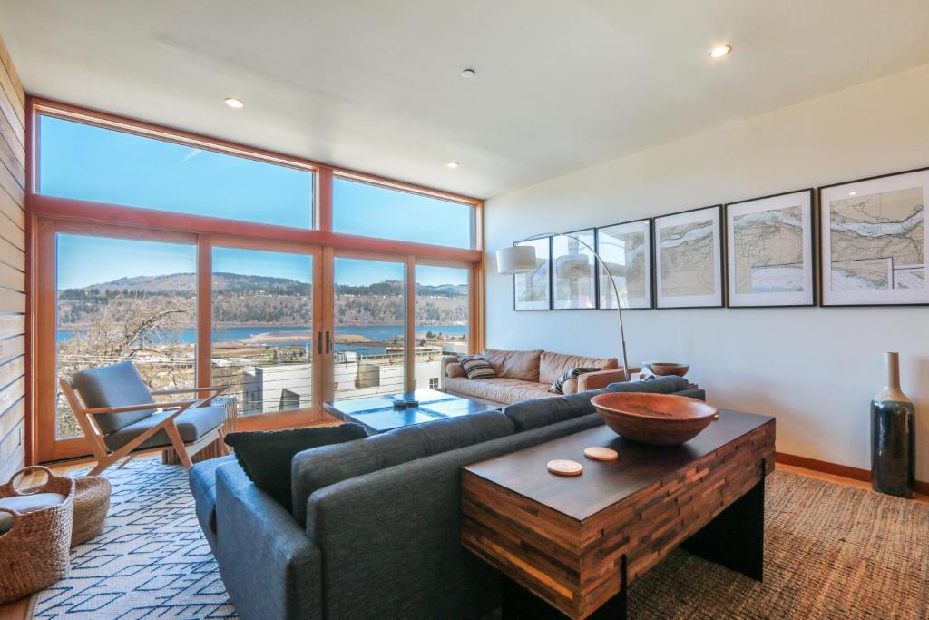 a living room with a couch and a table at ALOFT Airy Design with River View in Hood River