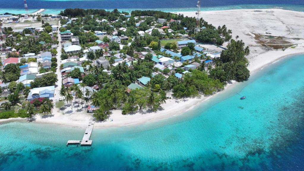an aerial view of an island in the ocean at Feeali Buddies Inn 