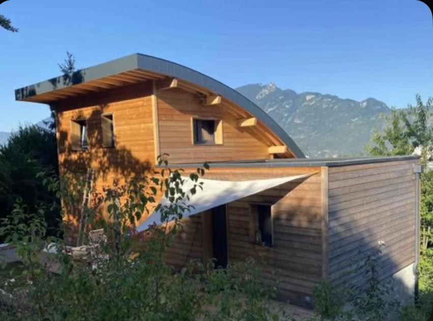 a wooden house with a gambrel roof at Orevard coin de paradis in Aix-les-Bains