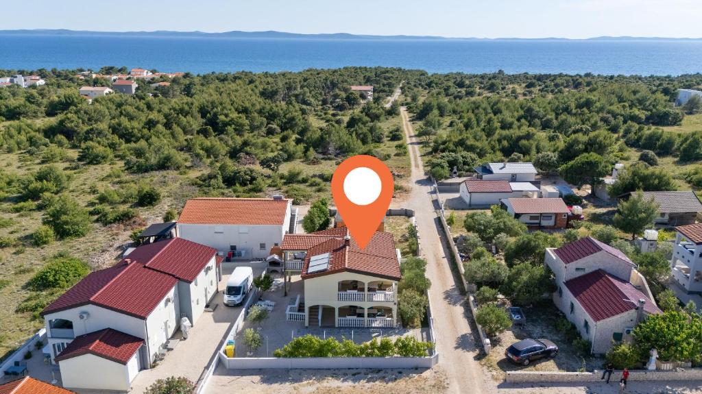 an aerial view of a house with a red marker at Apartment Draga in Vir