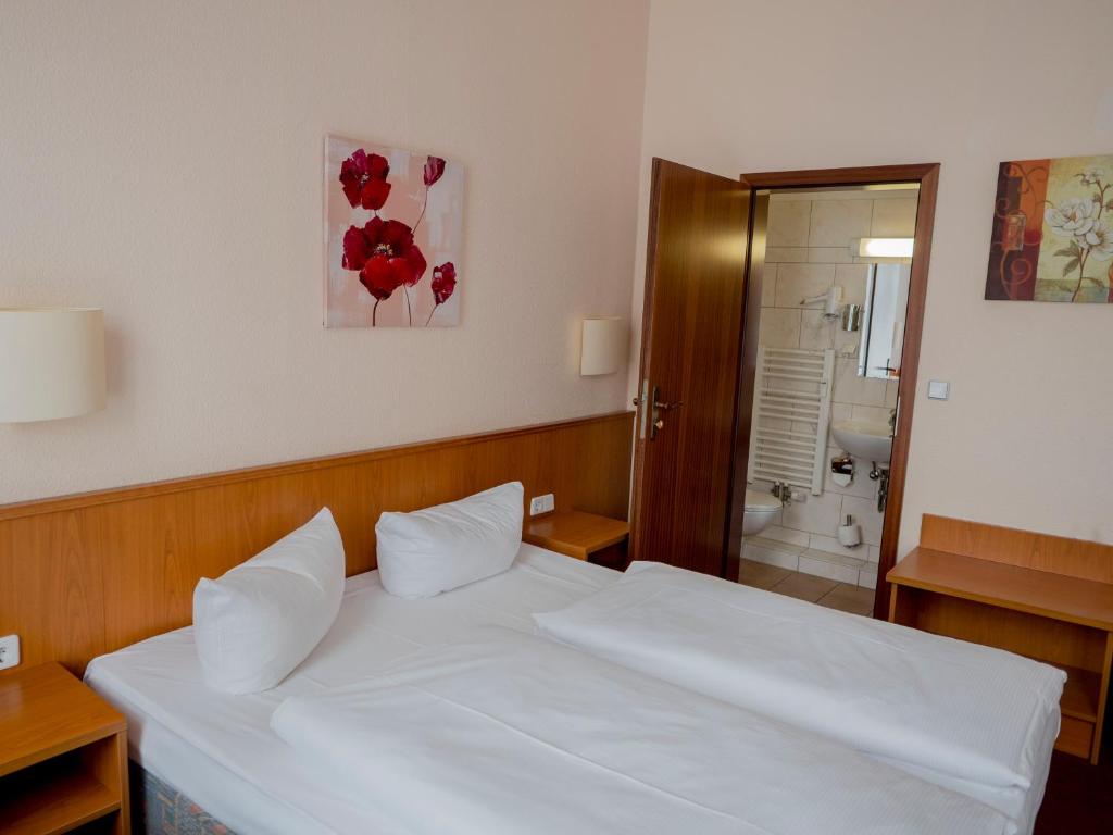 Postel nebo postele na pokoji v ubytování Hotel Residence am Hauptbahnhof