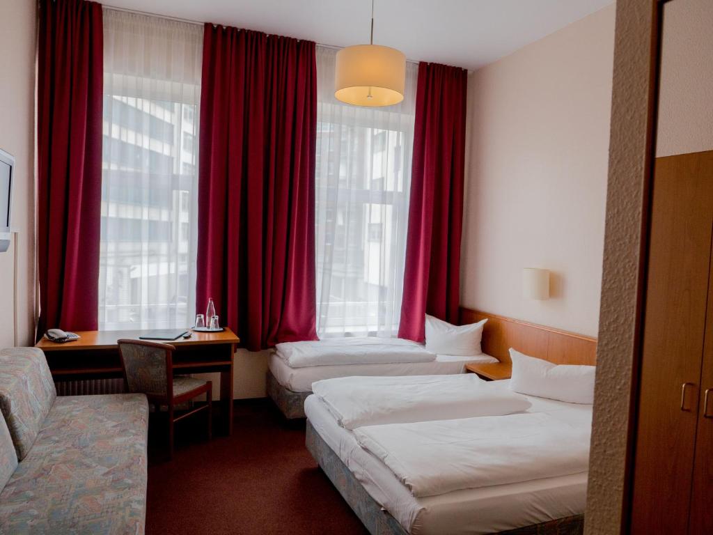 Postel nebo postele na pokoji v ubytování Hotel Residence am Hauptbahnhof
