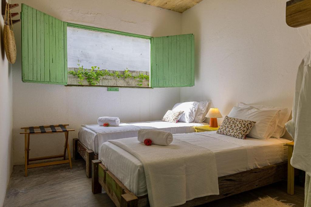 Postel nebo postele na pokoji v ubytování Casa Mangará