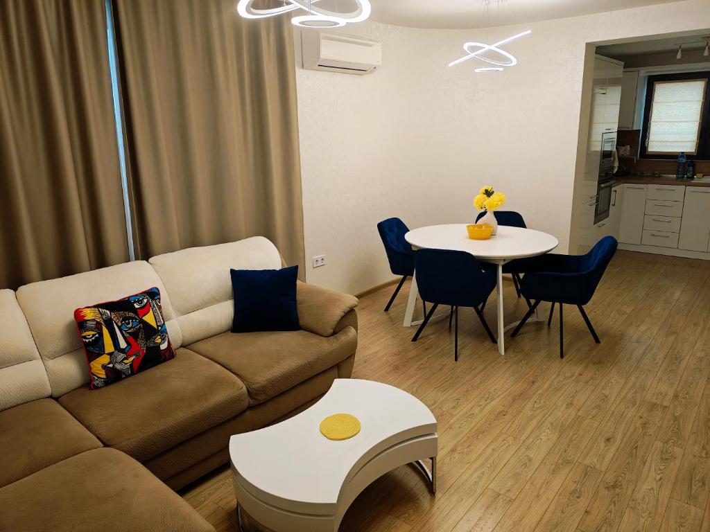 a living room with a couch and a table at Trend Apart in Burgas City