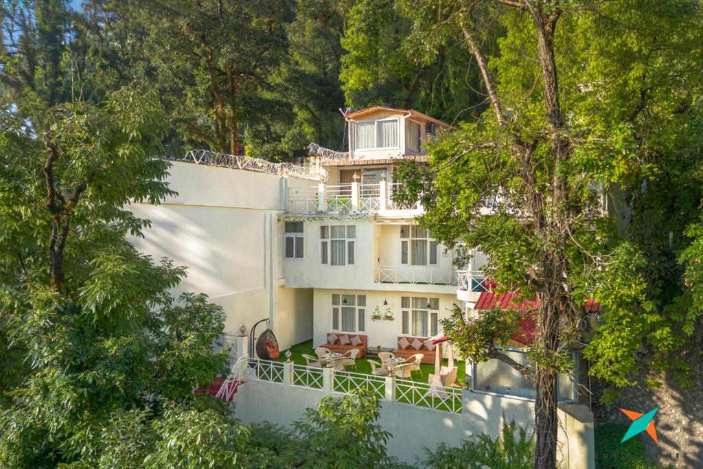 an aerial view of a house with trees at Zostel Homes Mussoorie in Mussoorie