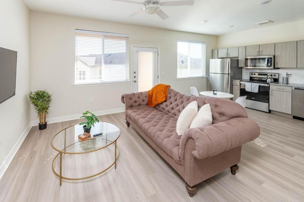 a living room with a couch and a table at Comfy One BedRoom Apartment in Cedar Park